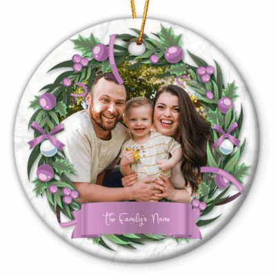Custom Ornament With Picture featuring a custom photo framed with holly leaves and berries, with a ribbon banner displaying the family name.