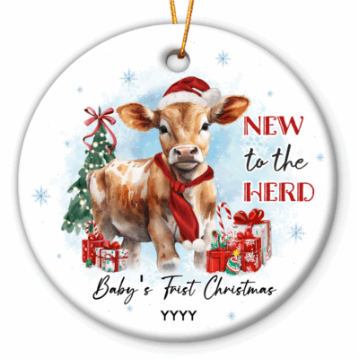 Cow Baby First Christmas Ornament featuring a cute calf in a Santa hat and red scarf, surrounded by gifts and a Christmas tree, with the text New to the Herd and customized with baby’s name and year