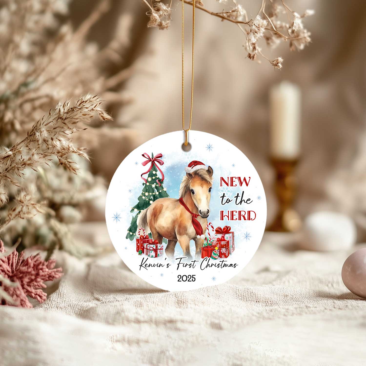 Personalized Horse Ornament For Kids featuring a cute pony wearing a Santa hat and red scarf, with Christmas tree, gifts, and text New to the Herd, customized with baby’s name and year.