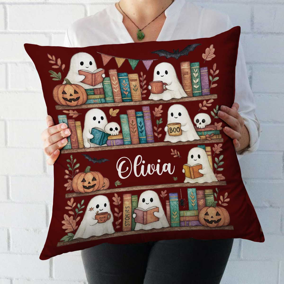 Personalized ghosts bookshelf pillow with custom name, cute spooky Halloween cushion for book lovers, cozy fall décor and seasonal gift.