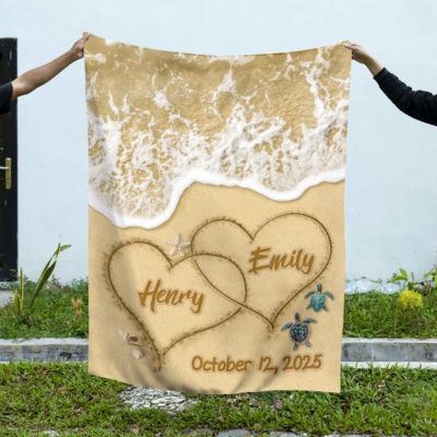 Custom Couple Name Blanket with beach design, two hearts drawn in the sand with personalized names and customizable wedding date, romantic anniversary gift.