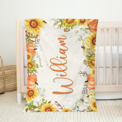 Personalized autumn baby blanket with name and pumpkin design, custom fall baby shower gift and cozy nursery bedding for baby girl.