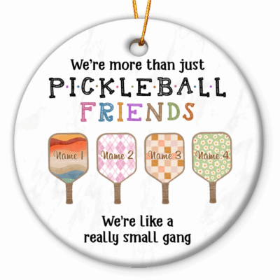 Personalized Pickleball Ornament - Sport Gift for Pickleball Lover featuring colorful paddles with custom names and the quote ‘We’re more than just pickleball friends, we’re like a really small gang,’ hanging on a Christmas tree, the perfect gift for pickleball lovers and friends.