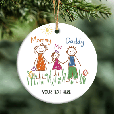 Personalized photo ornament with kids’ artwork and custom text, displayed on Christmas tree.