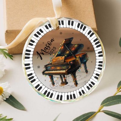 Personalized piano ornament with custom name, music-themed Christmas gift for pianist or music lover, elegant black and white keepsake decoration.