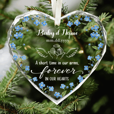 Custom Baby Loss Heart Glass Ornament - Baby Memorial Gift with blue forget-me-not flowers, personalized with name, date, and angel wings design, featuring the quote “A short time in our arms, forever in our hearts,” hanging on a Christmas tree.