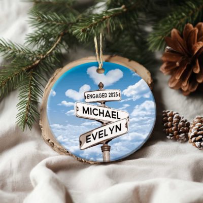 Personalized engagement ceramic ornament featuring couple names on a street sign design, romantic Christmas keepsake gift for fiancé and fiancée.
