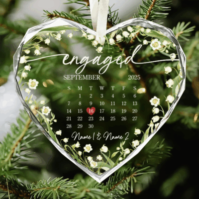 Personalized engaged glass ornament featuring a custom calendar design with couple names and engagement date, Christmas or engagement gift for fiancé and fiancée.