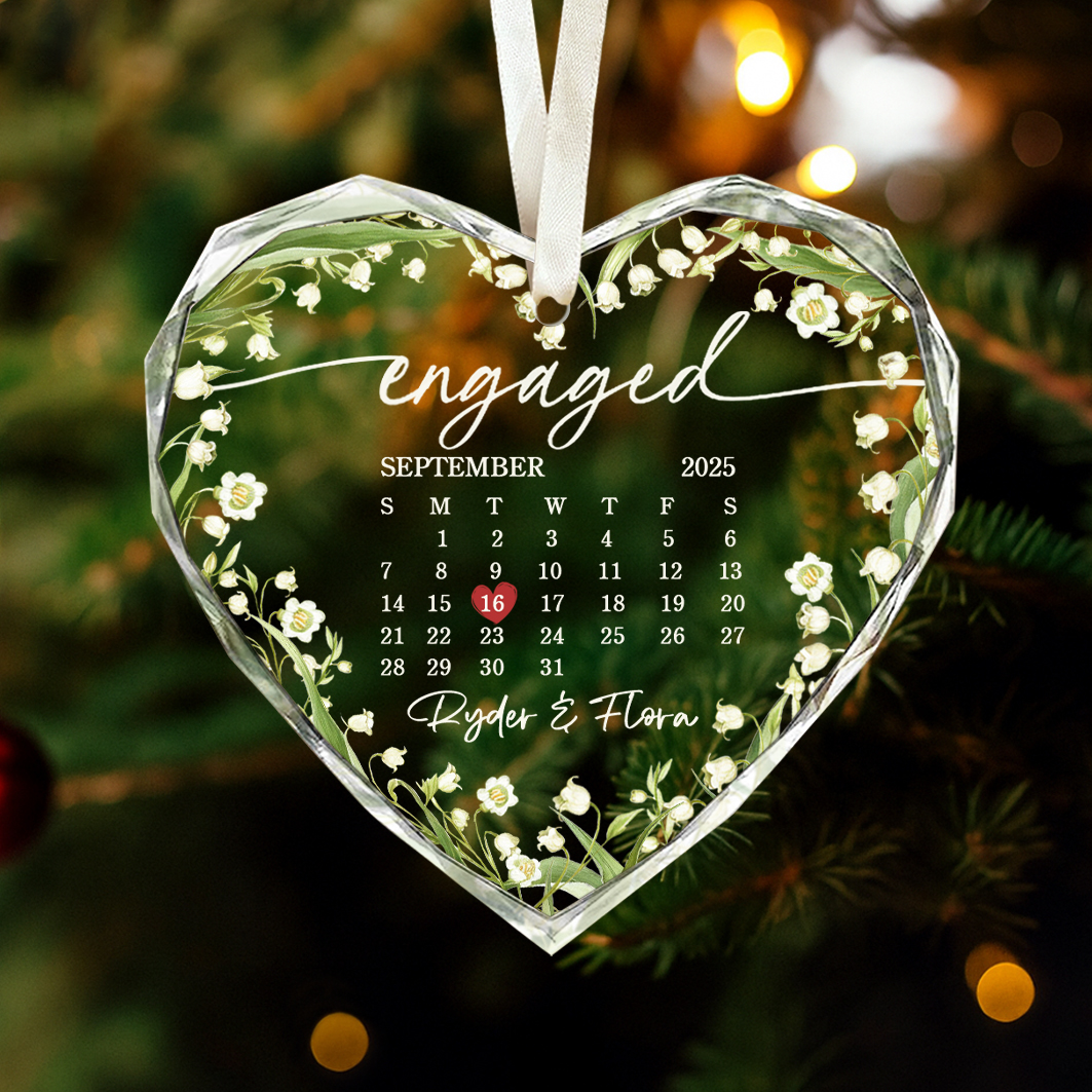 Personalized engaged glass ornament featuring a custom calendar design with couple names and engagement date, Christmas or engagement gift for fiancé and fiancée.