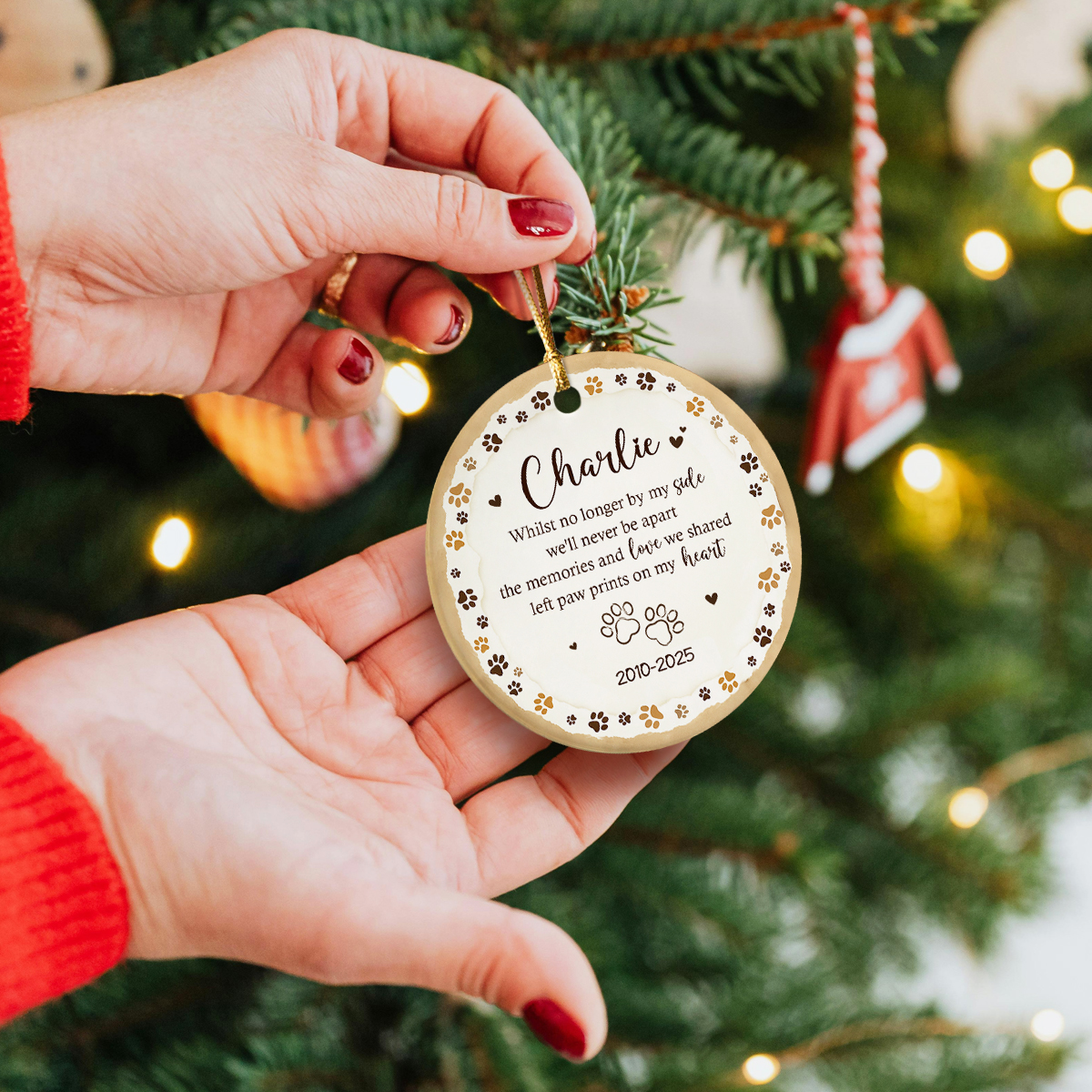 Personalized dog memorial ornament featuring paw prints and custom pet name, sympathy gift for pet loss or remembrance keepsake for dog or cat owners.