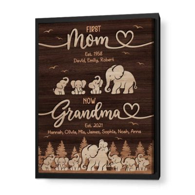 Custom First Mom Now Grandma Canvas - Mothers Day Gift for Grandma with rustic wood background, elephant family illustration, and custom kids and grandkids names, displayed on a wall as a meaningful gift for grandma
