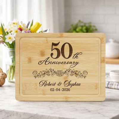 Personalized 50th Anniversary Cutting Board - Wedding Anniversary Gift engraved with names and date, displayed as a golden anniversary gift for couples