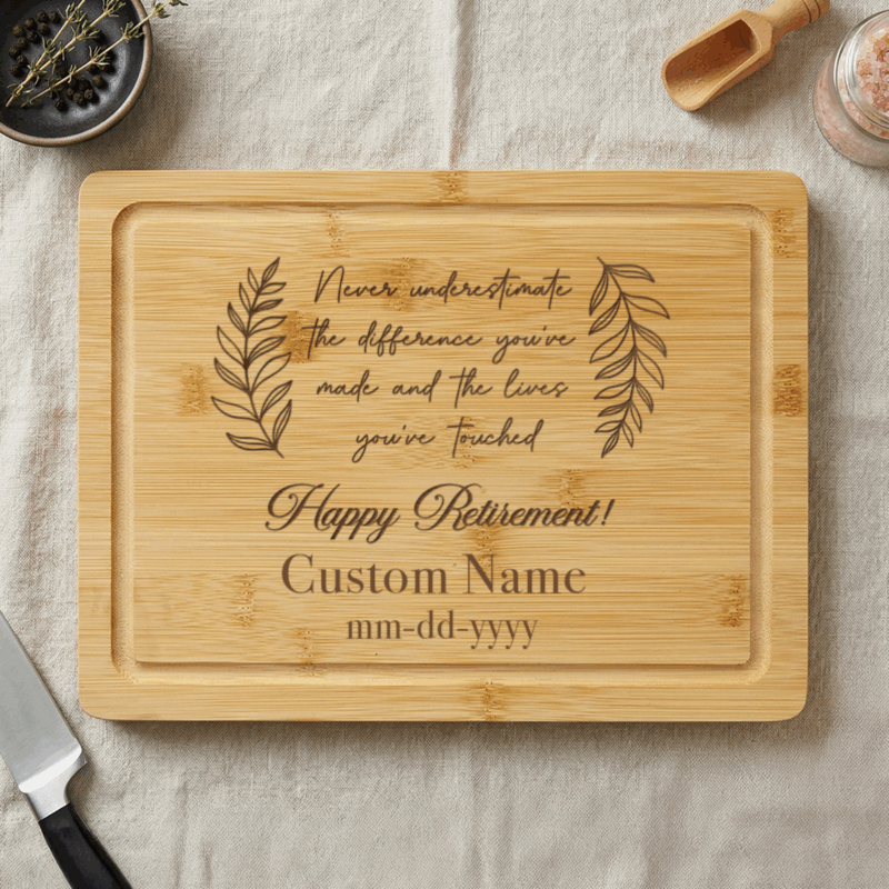 Retirement Personalized Cutting Bamboo Board - Happy Retirement Gift engraved with retirement message, name, and date, surrounded by kitchen items, used as a farewell gift for coworker
