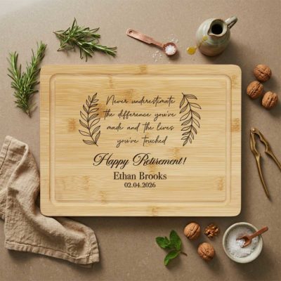 Retirement Personalized Cutting Bamboo Board - Happy Retirement Gift engraved with retirement message, name, and date, surrounded by kitchen items, used as a farewell gift for coworker