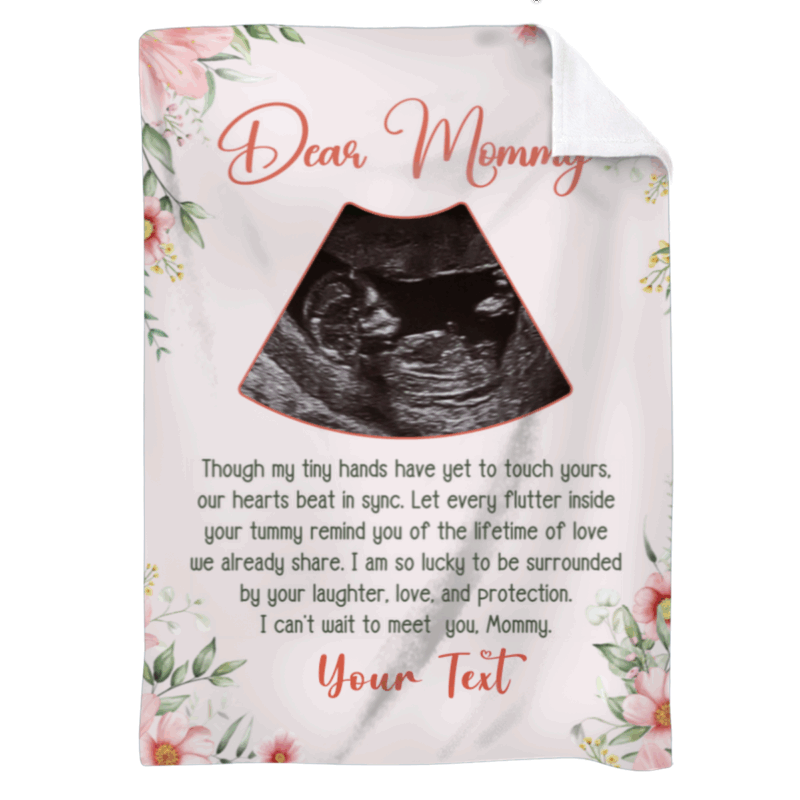 Personalized Ultrasound Photo Blanket – Mother To Be Mothers Day Gift with floral border, “Dear Mommy” message, and baby sonogram image, held in a cozy living room as a gift for expecting mom