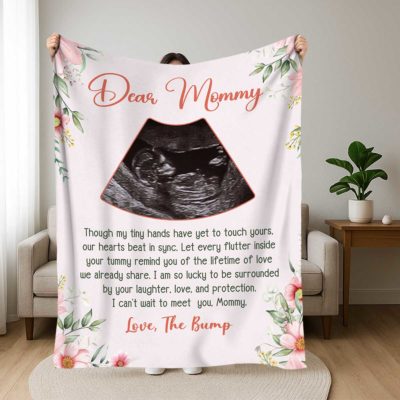 Personalized Ultrasound Photo Blanket - Expecting Mom Gift with floral border, “Dear Mommy” message, and baby sonogram image, held in a cozy living room as a gift for expecting mom