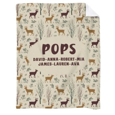 Hunting Grandpa Blanket with Grandkids Name - Fathers Day Gift for Grandpa with deer and forest pattern, grandpa's nickname, and grandkids names, held up in a cozy room as a Father’s Day gift for grandpa