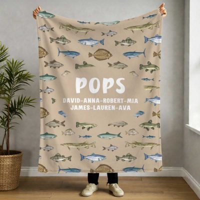 Custom Papa Fishing Blanket with Kids Name - Fathers Day Gift Gift for Grandpa with various fish illustrations, Grandpa's nickname, and grandkids names, held up indoors as a Father’s Day gift for grandpa